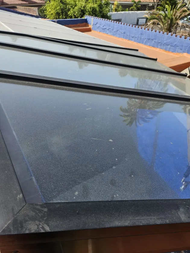 Skylight covered in dust and salt before cleaning