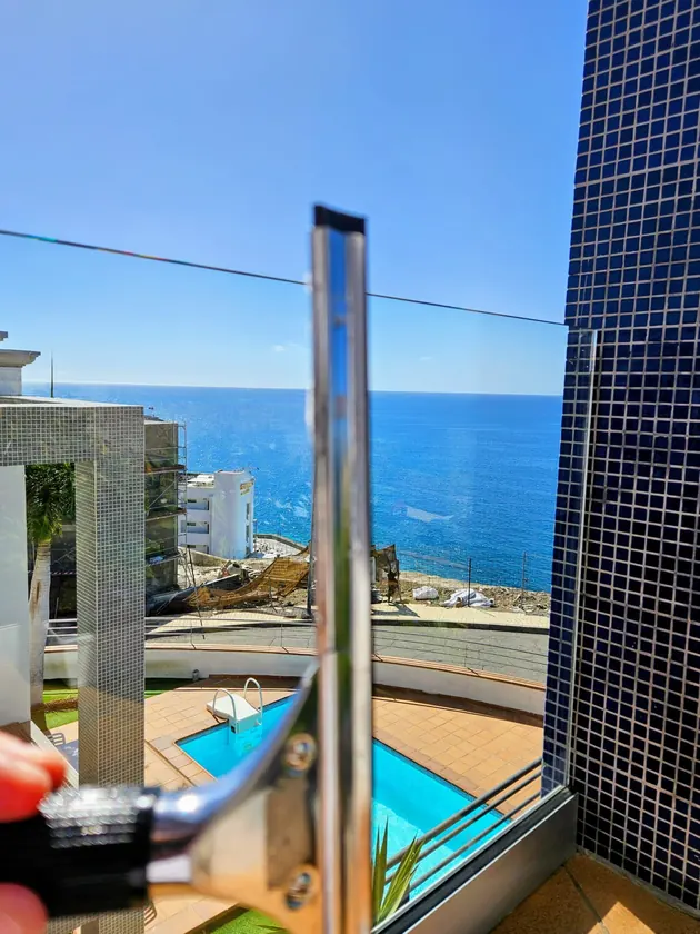 Glass terrace balustrade facing the Atlantic