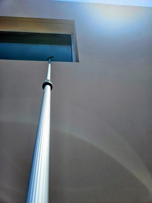 Window cleaning at height with a telescopic pole