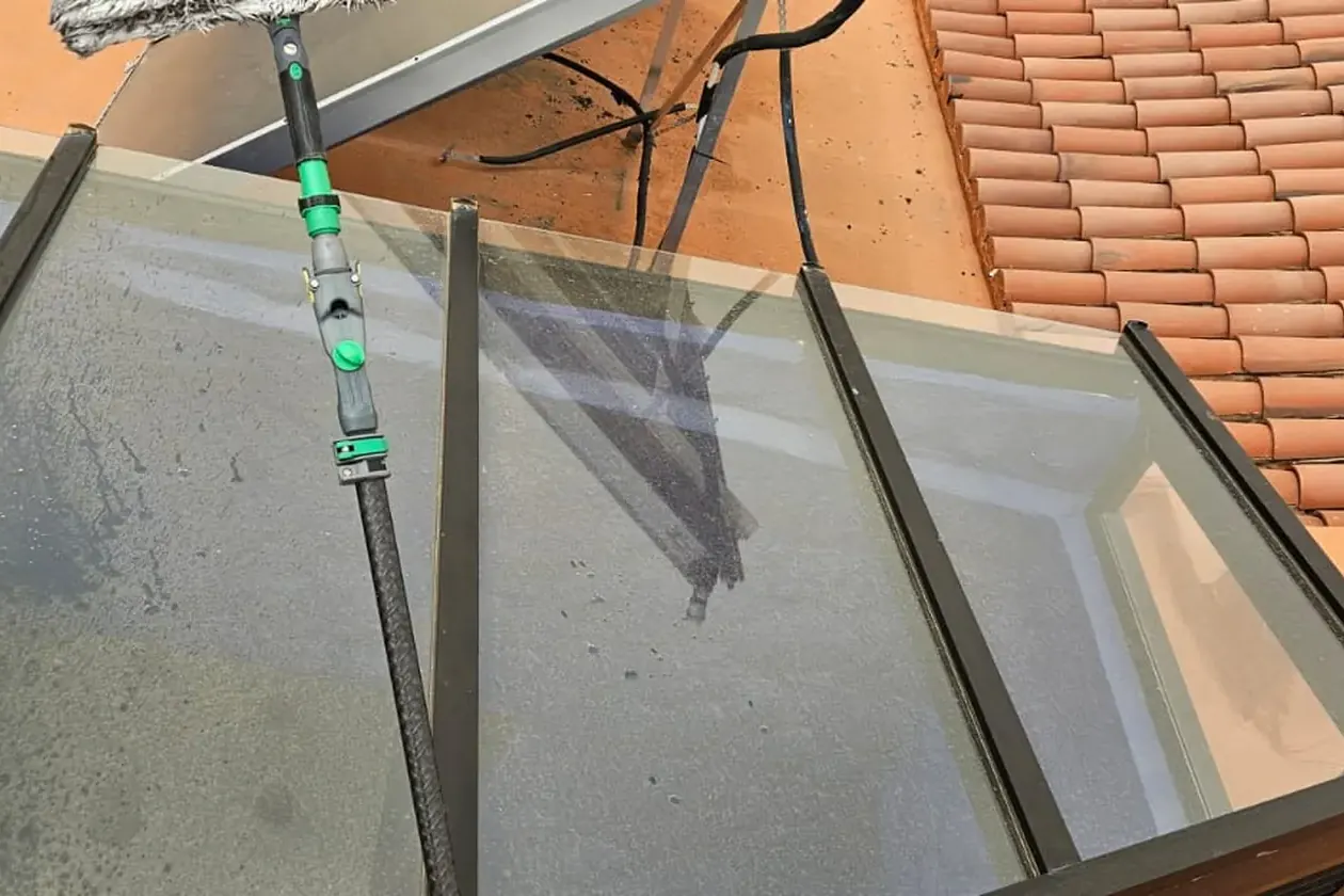 Skylight and glazed roof cleaned with a pole